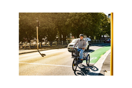 adult riding a trike